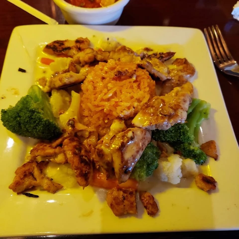Fiesta Delight with chicken, rice, vegetables and cheese sauce.